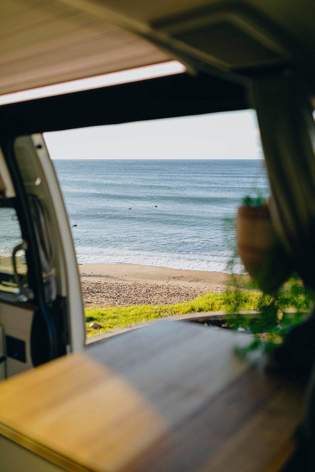 View of the beach from a campervan